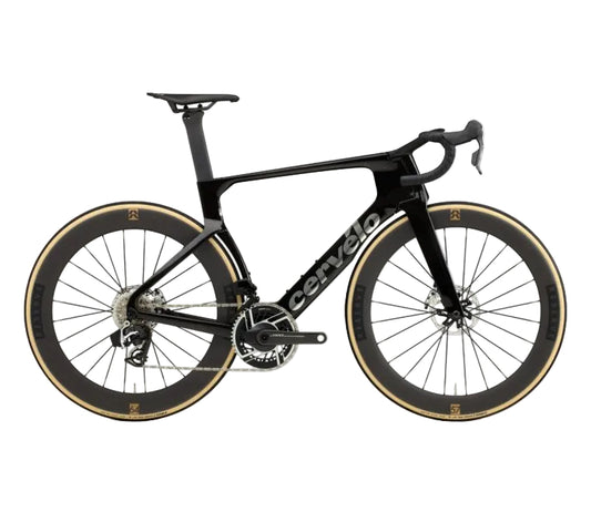 A black Cervello road racing bicycle with deep carbon fiber wheels and tan sidewall tires, shown from a side profile on a white background.